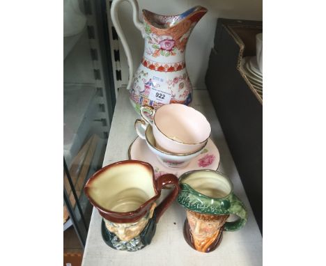 A 19th century chinoiserie jug, two Doulton small character jugs and two cups and saucers 