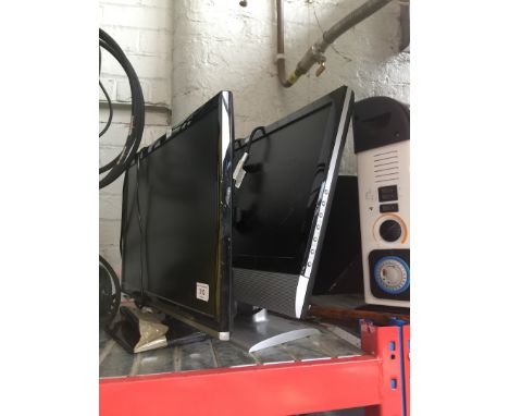 A Polaroid monitor and a 22" Samsung TV with remote 