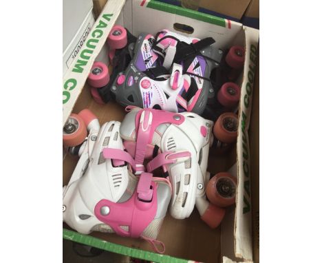 2 pairs of children's roller skates 