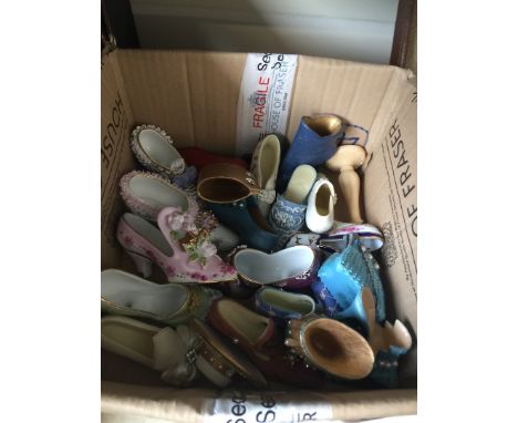 A collection of model porcelain shoes etc. 