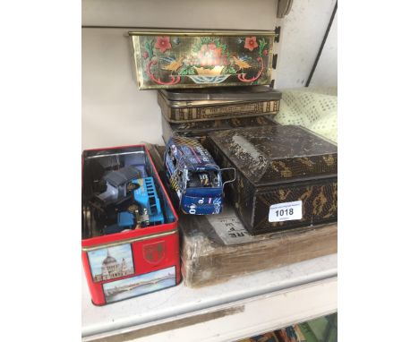 Various tins and some model vehicles 