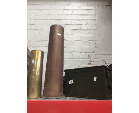 A ammunition box and 2 shells 