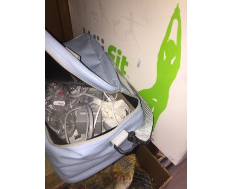 A Wii console, accessories , cables and a Wii fit board in box 