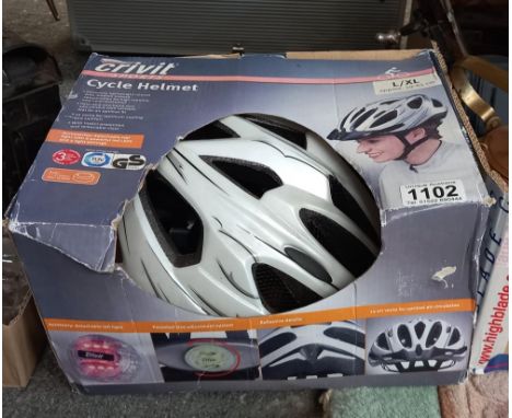 A boxed, unused cycle helmet &amp; Crivit shorts