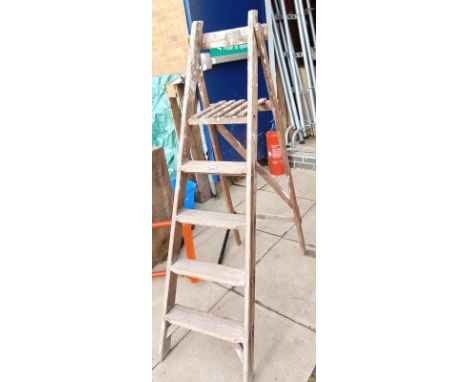 A 4 step pine step ladder