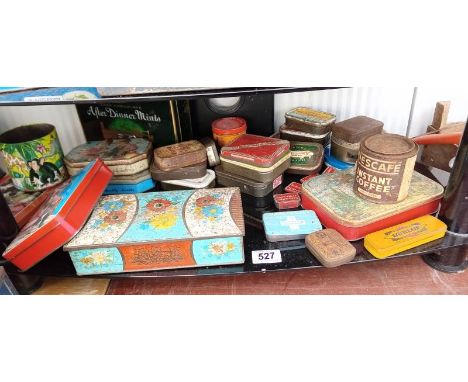 A shelf of collectable tins