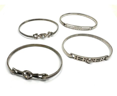 Four silver Celtic design bangles including Kit Heath (45g) 