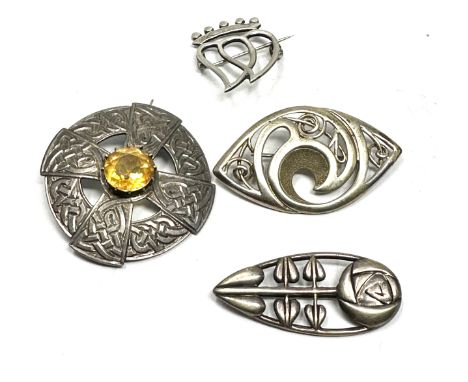 Four silver Celtic design brooches including one by Ola Gorie (36g) 