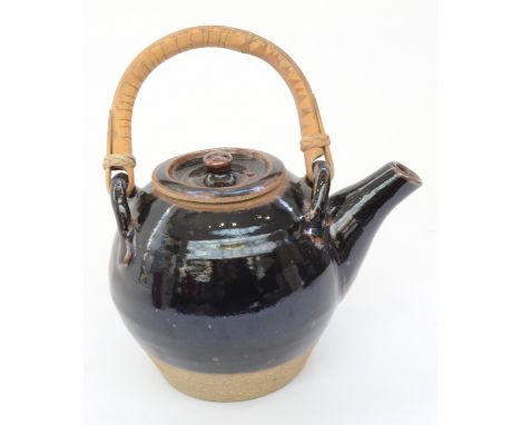 John BEDDING (1947)Leach standard-ware teapot, tenmoku glaze Made at Leach Pottery circa 1975Leach Pottery stampHeight 22 cm 
