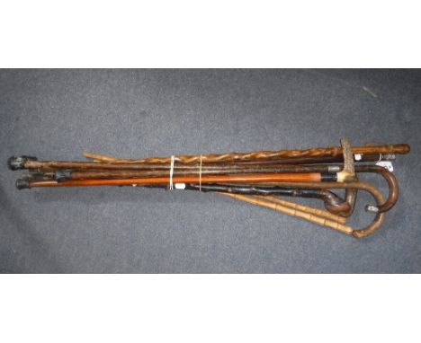 A SILVER MOUNTED WALKING STICK and other similar walking sticks