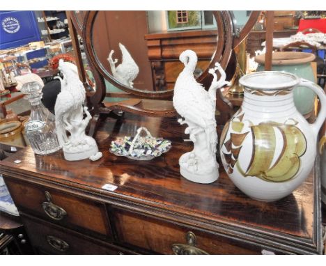 A 19TH CENTURY CERAMIC BASKET with floral encrusted decoration, a pair of Parian birds, a handled vase and a glass decanter