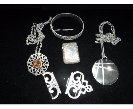 A SILVER VESTA CASE, half buckle, two pendants and a white metal bangle