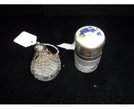 A SILVER TOPPED AND ENAMEL SCENT BOTTLE and one other Continental scent bottle (2)