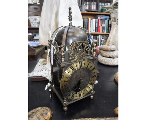 A BRASS LANTERN CLOCK by 'Smiths,' 10" high