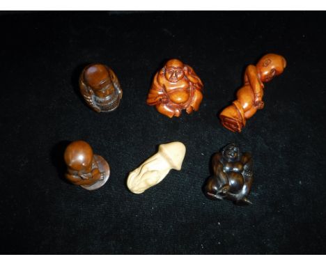 A COLLECTION OF JAPANESE CARVED WOOD NETSUKE including erotic subjects (6)