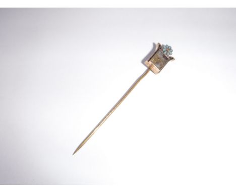 A 19TH CENTURY YELLOW METAL STICK-PIN, set with a hardstone, a flower and neo-classical motifs