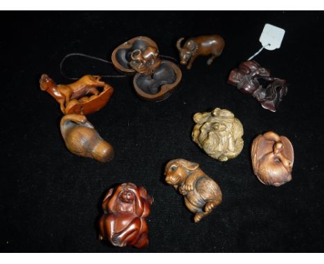 A COLLECTION OF JAPANESE CARVED WOOD NETSUKE including monkeys, rabbit, duck and other animals (9)
