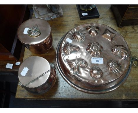 A VICTORIAN STYLE COPPER MOULD, a similar tea caddy and a copper lidded pot (3)
