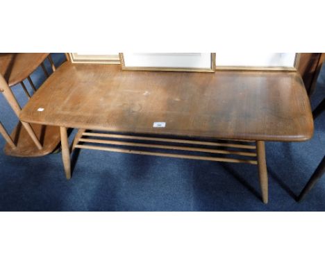 ERCOL: A PALE ELM COFFEE TABLE with magazine undertier, 41" long