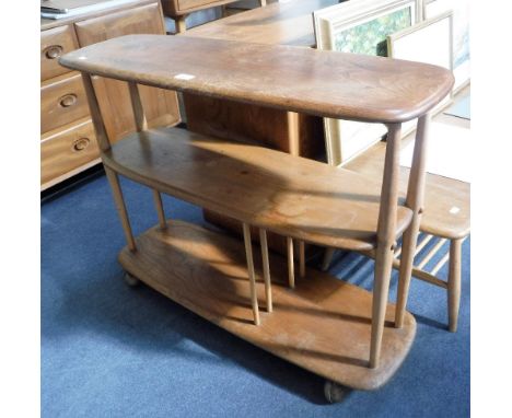 ERCOL: A PALE ELM THREE TIER ROOM DIVIDER on castors, 36" long