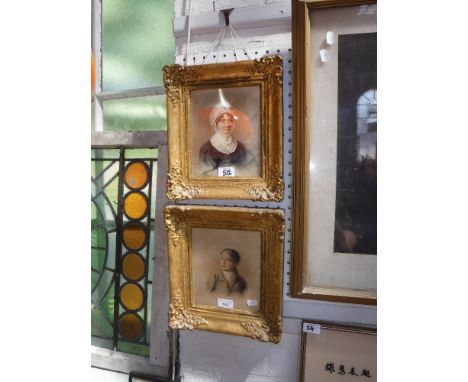 A VICTORIAN WATERCOLOUR PORTRAIT of a woman wearing a bonnet and a companion picture of a young man, in gilt frames