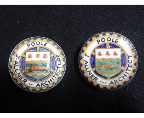 A POOLE POTTERY BADGE 'J. Allner Architecture' and one other similar Poole Pottery lapel badge, 22 dia