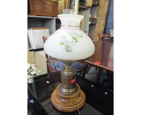 A vintage brass and oak lamp in the form of an oil lamp with floral opaque glass shade 54cm h Location: A1 