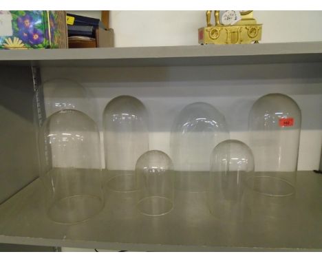 A group of glass clock domes of various sizes (7) Location: Porters 