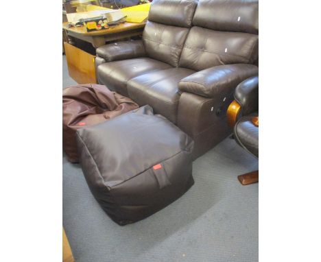 A two sectional electric reclining two seater brown leather sofa together with a modern square pouffe and a Next beanbagLocat