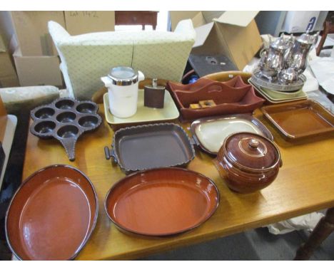 Ten French and German ceramic oven dishes together with a mahogany cutlery tray, a silver plated four piece tea set, a thermo