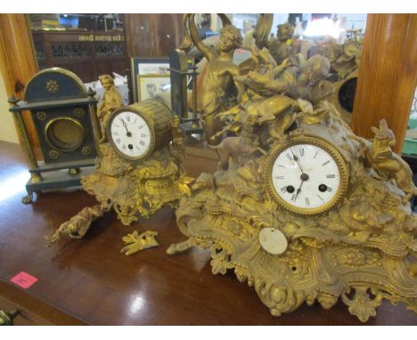 Two Victorian ornate gilt metal mantle clocks A/F together with a 19th century gilt metal and wood mantle case and a clock mo