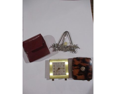 A silver miniature easel with a Scottish theme with a central thistle in amber glass, together with a tortoiseshell compact A