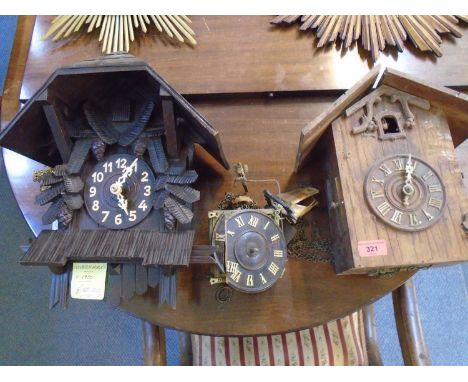Two wooden cased cuckoo wall clocks and a cuckoo clock movement A/F 