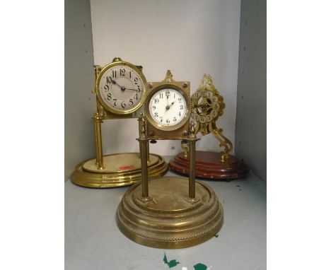 A group of three anniversary clocks to include a Gustave Becker clock, and two others, one striking on a bell 