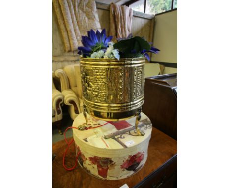 Group of three large faux roses, a faux flower bouquet in a ceramic planter, brass jardiniere filled with faux flowers and a 