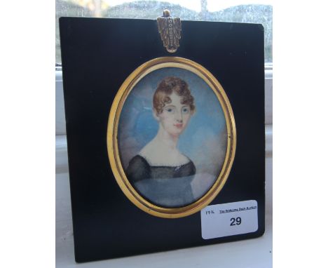 Early 19th Century miniature portrait, Young lady in black dress, ebonised frame, later label verso Thomas Richmond