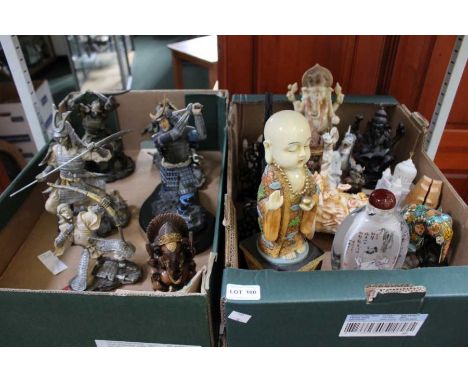 A box containing a model samurai and a box of collectables
