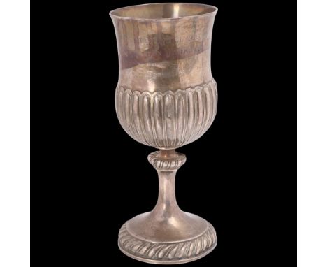 A George III Irish silver trophy goblet, possibly Thomas Jones, indistinct Dublin date letter, half fluted thistle form, with
