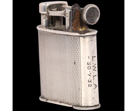 An Art Deco silver 'The Classic Lighter' pocket lighter, Adie Brothers Ltd, Birmingham 1930, allover engine turned decoration