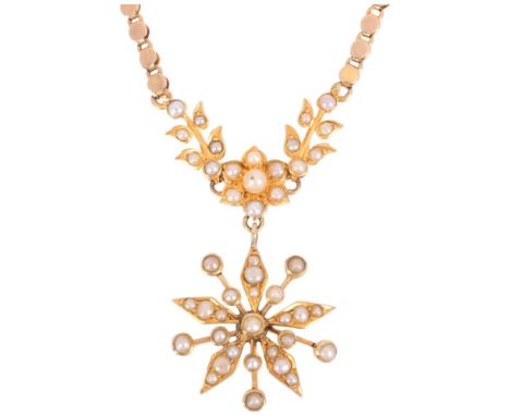 An Antique Victorian 9ct gold split pearl flowerhead pendant necklace, on integral 9ct disc link chain, pendant 34mm, chain 4
