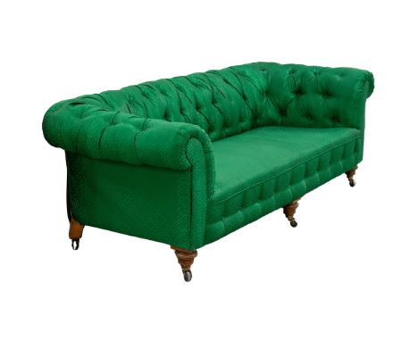 VICTORIAN CHESTERFIELD SOFA. Walnut in designer green fabric on castors, 70cm H x 222cm W x 93cm D.