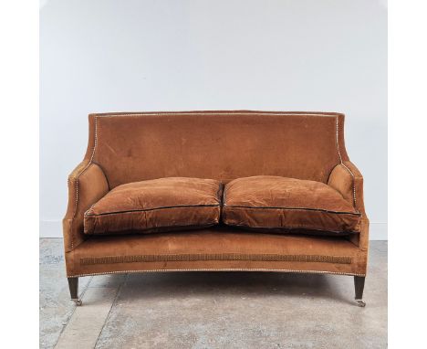 WILLIAM YEOWARD PALMER CURVED SOFA. Concave in brown velvet on beech legs and chrome castors, 88cm H x 149cm W.