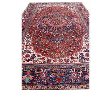 ANTIQUE PERSIAN HERIZ CARPET. 350cm x 250cm.