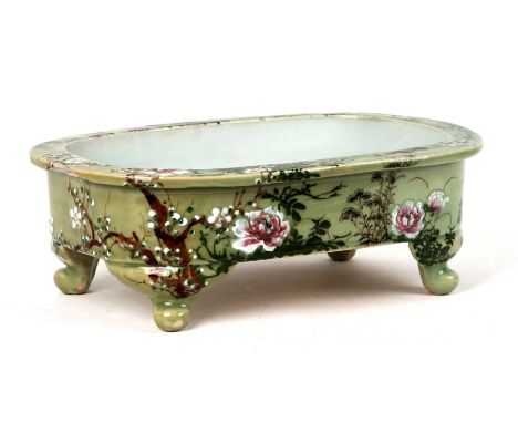 A Chinese celadon glaze shallow planter decorated with flowers, 36cms (14ins) wide.Condition ReportStar crack to base and lar
