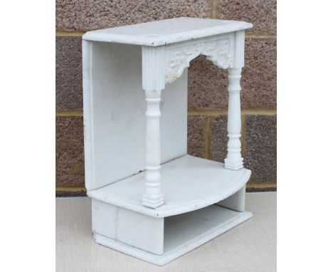 A carved alabaster two-tier wall shelf, 41cms (16ins) wide.Condition ReportGood overall condition, minor nibbling to edges an