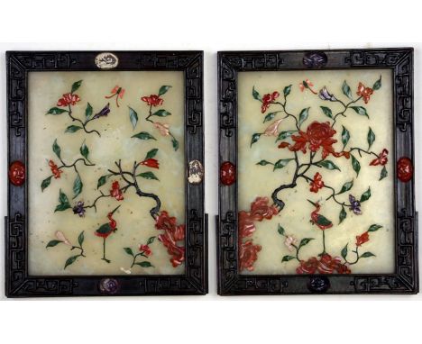 A pair of jade and hardstone hardwood framed panels decorated with birds, insects and foliage, each overall 19 by 23cms (7.5 