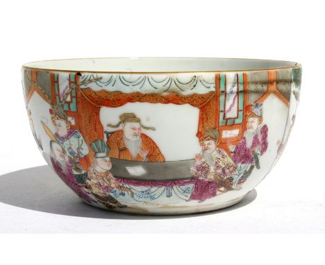A Chinese famille rose bowl decorated with figures in a court scene, red seal mark to the underside, 16cms (6.25ins) diameter