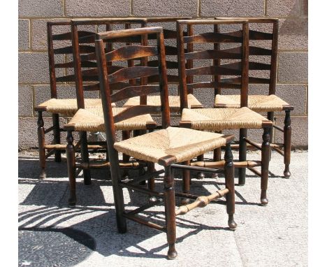 A set of six ladder back chairs with rush seats