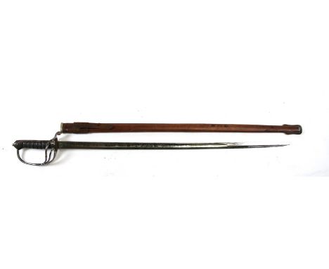A Henry Wilkinson Royal Artillery Officer's dress sword in a leather scabbard, 107cms (42ins) long. serial number 56641 along