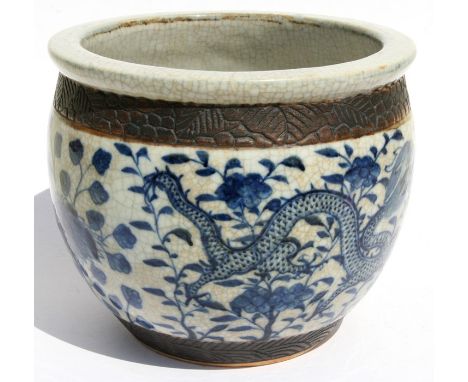 A Chinese blue &amp; white crackle glaze planter decorated with dragons amongst foliage, 18cms (7ins) high.Condition Report
C